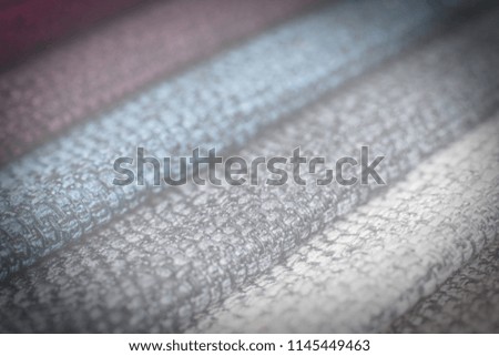 Colorful upholstery fabric samples background. Abstract background, empty template. Selective focus.
