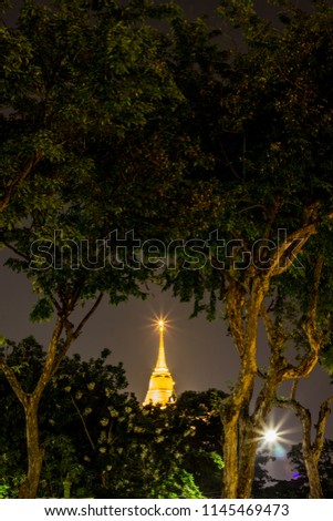 Night scene of Phu Khao Thong (Golden Mountain) in Wat Saket temple compound,Pom Prap Sattru Phai district,Bangkok,Thailand. Royalty-Free Stock Photo #1145469473