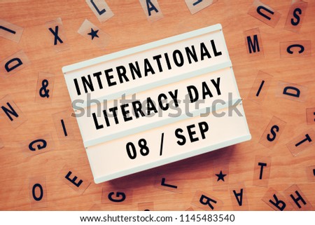 International literacy day, September the 8th on lightbox, top view