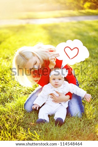 Happy mother with child in autumn day