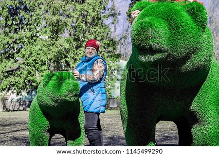 pictured in the photo Green bear from lawn grass. Artificial bear