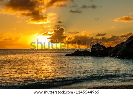 Travel photo in St. Barths, Caribbean. Amazing view of sunset on Shell Beach in Gustavia, Caribbean.