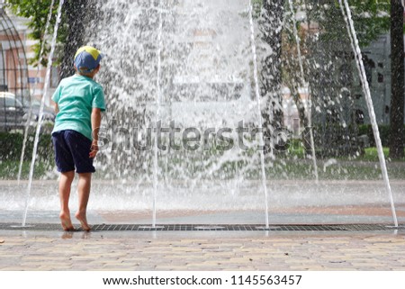 GOMEL, BELARUS Children bathing in the fountain. Square named after. Gromyko.