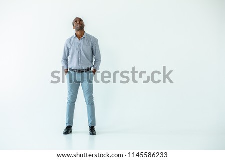 Let me think. Handsome adult afro american man being involved in toughts while standing isolated on white background Royalty-Free Stock Photo #1145586233