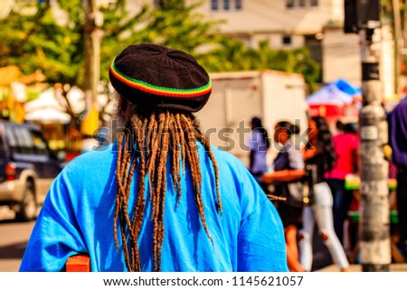 A rasta man walking of the streets of Saint Lucia, Caribbean Islands. Royalty-Free Stock Photo #1145621057