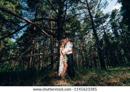 bride and groom in the forest