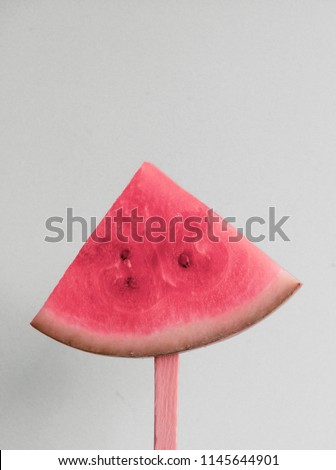 Simple and sweet concept photograph created with a watermelon popsicle 