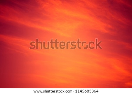 Red dramatic background. Fiery red sunset sky. Red clouds sky. Cataclysm concept. Scenic Wallpaper or Web banner With Copy Space.
