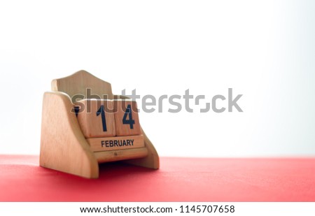 valentine's day concept. wooden calendar 14 February with soft-focus and over light in the background