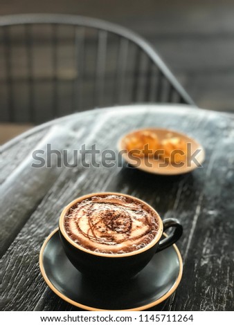 Coffee cup on sodden background