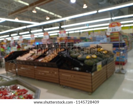 Blurred Supermarket selection of pasta, ketchup, condiment, tomato sauce and canned vegetable on shelves in store at Humble, Texas, US. Aisle, row variety product, refocused background, bokeh light.

