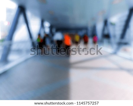 Abstract background of people walk on footbridge at rush hour