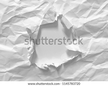 Hole in the paper background, copy space.