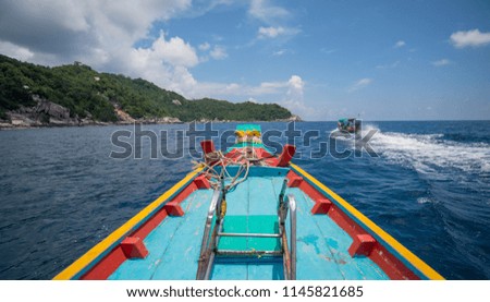 Traditional wooden boat in a picture perfect tropical Sky with clouds and ocean at koh tao island,Thailand ,Asia