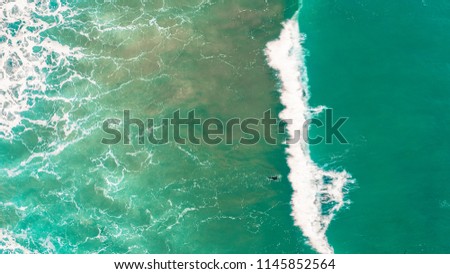 Wave Surf Beach Aerial, Beach on aerial drone top view with ocean waves reaching shore, top view aerial photo from flying drone of an amazingly beautiful sea landscape. Ocean Wallpaper. wave pattern.