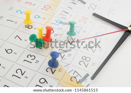 Clock and calendar page with push pins