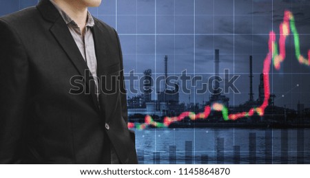 Investment in energy and fuel business. Double exposure Businessman working on digital tablet with power plant, oil refinery and raising graph background
