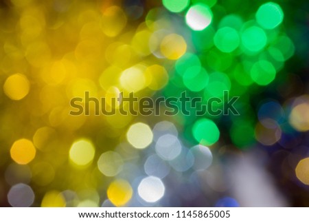 Christmas background with blur golden green silver  lights boker