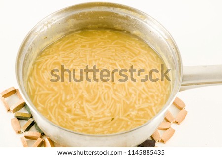 Close up picture of italian vegetable soup with pasta in pot