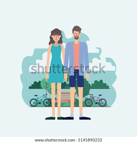 young couple in the park with bikes