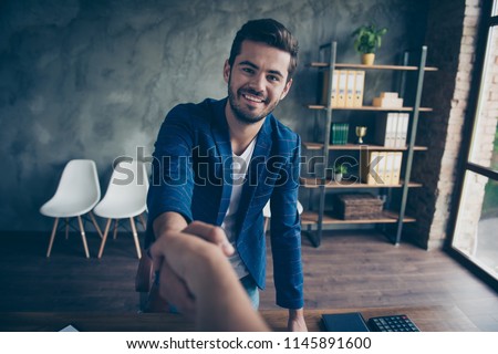 Welcome to the office! Handshake of two men after successful negotiations. POV view Royalty-Free Stock Photo #1145891600