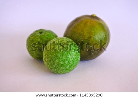 two small limes and one big lime