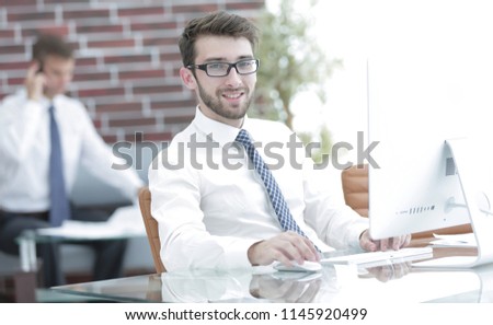 Manager works on a computer