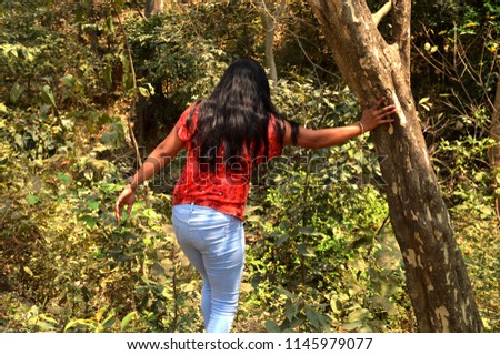 A young women wondring in forest in Indian state Maharashtra in mumbai.