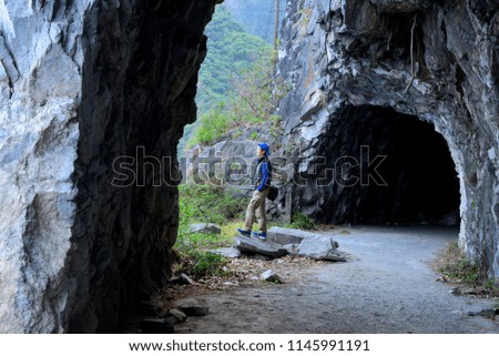 A man stands in isolation at a tunnel near Su Hua Road in Taiwan.