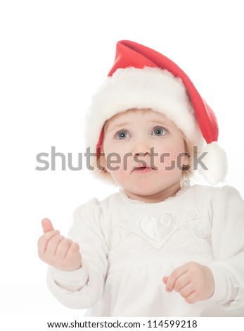 Cute baby girl in Santa's hat
