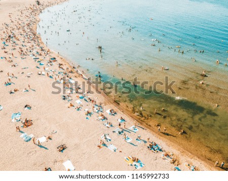 Aerial Drone View Of People Having Fun And Relaxing On Beach