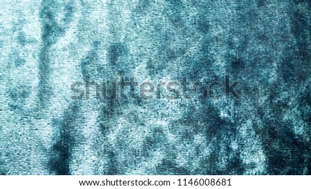 Dark green velvet fabric surface from above