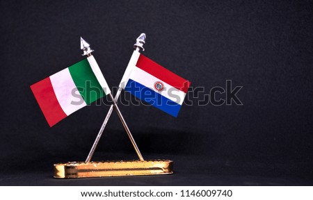 Italy and Paraguay table flag with black Background