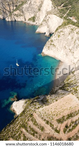 Aerial drone bird's eye view photo of natural private cove in beautiful and picturesque colorful traditional fishing village of Assos, island of Cefalonia, Ionian, Greece
