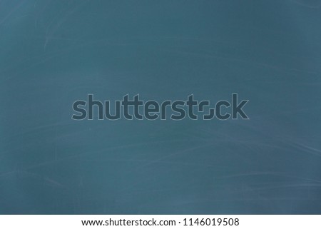 Closeup of empty blue blackboard with free copy space for text or image messages as background