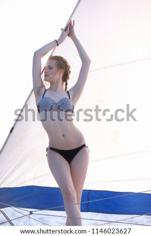 girl  on a yacht in the open sea on a sunny day