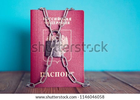 Russian passport in chains
