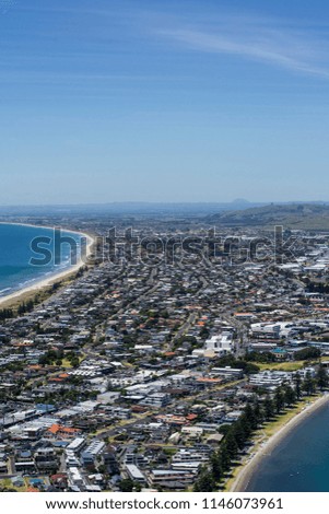 Travel New Zealand. Top view of the beach and Tauranga town from the top of Mount Maunganui, North Island. Popular tourist hiking attraction/destination.