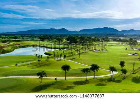 Golf course with a rich green turf beautiful scenery. Royalty-Free Stock Photo #1146077837