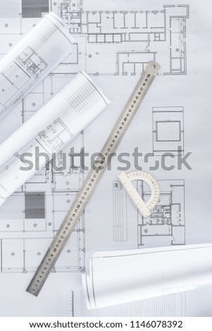 top view of architect blueprints with ruler and protractor