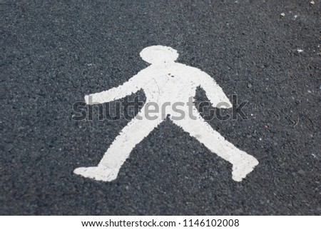 Sign of pedestrians on the ground