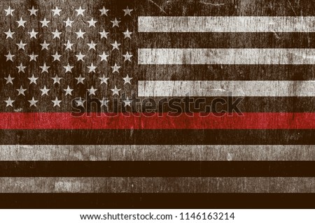 An aged textured firefighter support flag with a thin blue line.