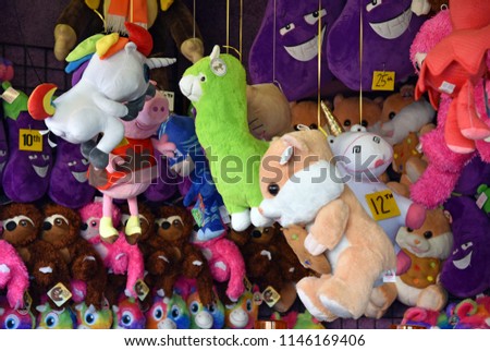 Stuffed animal prizes hanging at midway