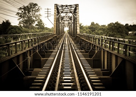 Vintage railroad tracks sepia color in grunge and retro style and old picture