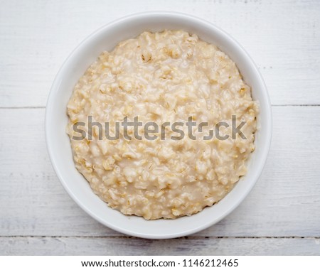 Top view of oats porridge Royalty-Free Stock Photo #1146212465