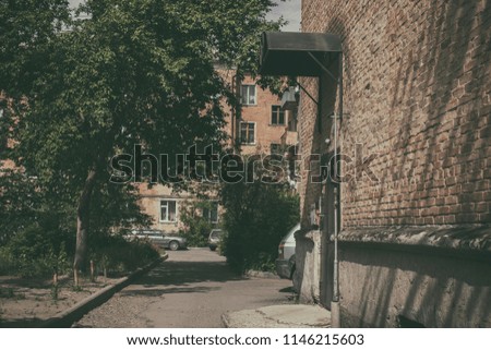 Courtyard of old buildings. Apartment building. Urban landscape.