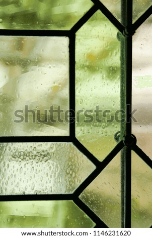 The castle window close up details vertical composition in green tones blurred background
