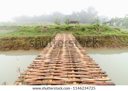 Soft focus and blur.The bamboo bridge was built with the faith of the people to the monks and temples in Asia, so the journey to the temple to pray for easier travel.