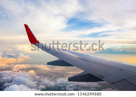 Morning sunrise with Wing of an airplane. Photo applied to tourism operators and fast and efficient transportation. picture for add text message or art work frame website. Traveling concept.
