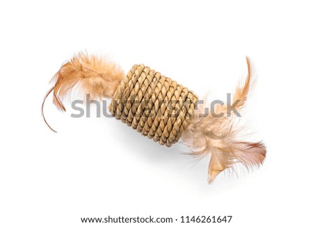 Straw toy with feathers for cat on white background. Pet accessory